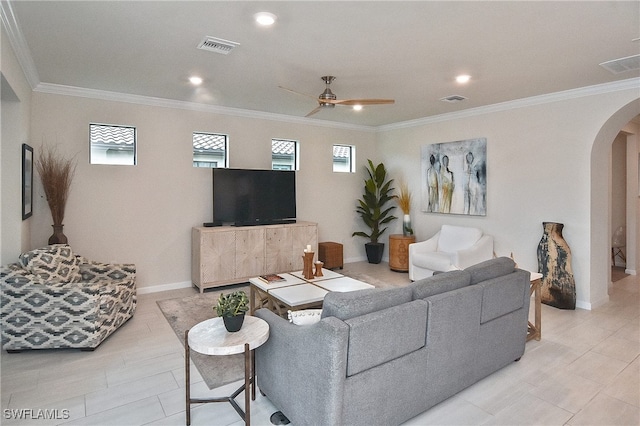 living room featuring ceiling fan and crown molding