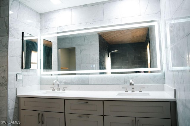 bathroom with tile walls and vanity