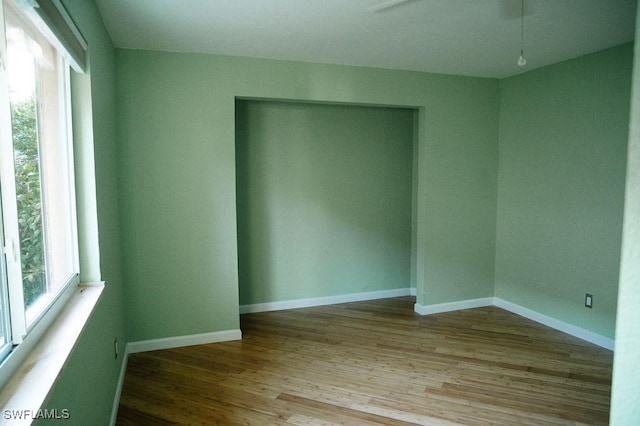 unfurnished room with light hardwood / wood-style floors