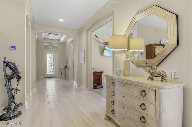 entrance foyer featuring light hardwood / wood-style flooring and ornamental molding