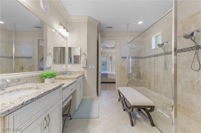 bathroom with vanity, tile patterned flooring, plenty of natural light, and ornamental molding