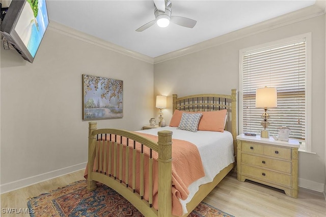 bedroom with ceiling fan, ornamental molding, and light hardwood / wood-style flooring