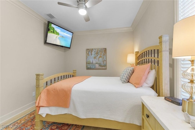 bedroom featuring ceiling fan and ornamental molding