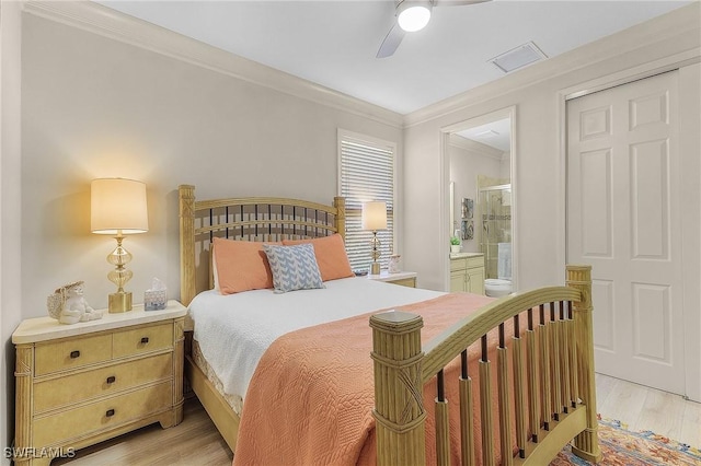 bedroom with ensuite bathroom, ceiling fan, ornamental molding, and light hardwood / wood-style flooring