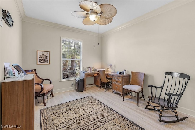 office space featuring ceiling fan, ornamental molding, and light hardwood / wood-style flooring