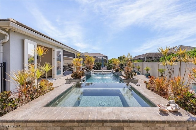 view of swimming pool featuring an in ground hot tub and pool water feature