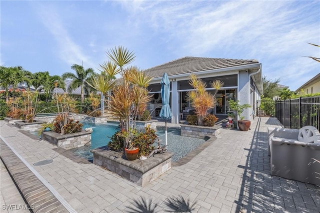 view of swimming pool with grilling area and a patio