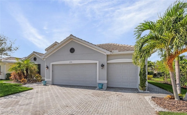 ranch-style home featuring a garage