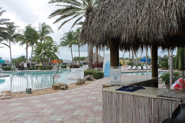 view of swimming pool featuring a patio area