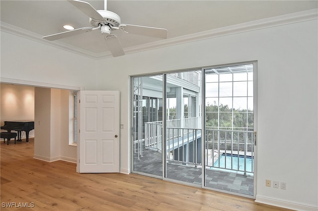 unfurnished room featuring ceiling fan, crown molding, and wood-type flooring