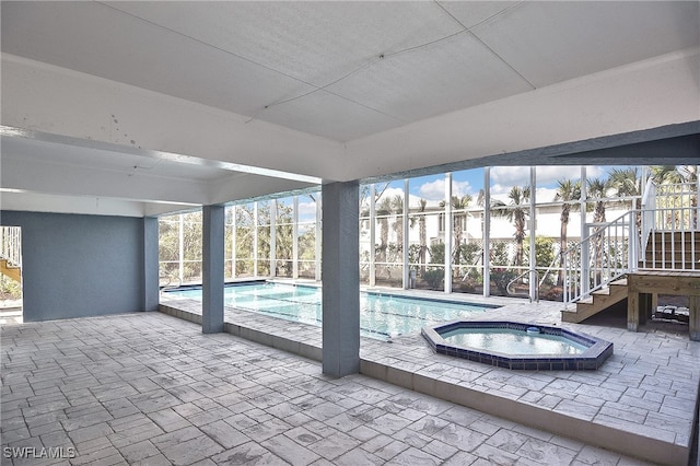 view of swimming pool with an indoor in ground hot tub