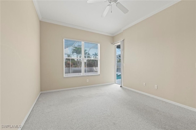 unfurnished room with ornamental molding, light colored carpet, and ceiling fan