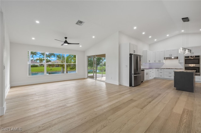 kitchen with pendant lighting, stainless steel appliances, light wood-type flooring, white cabinetry, and ceiling fan