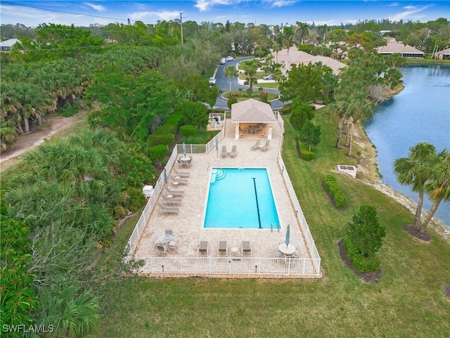 view of swimming pool featuring a water view and a patio area