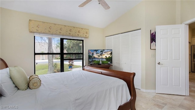 bedroom with vaulted ceiling, a closet, and ceiling fan