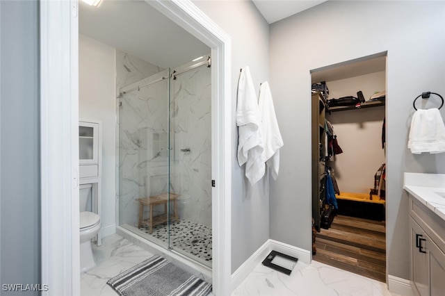 bathroom with vanity, toilet, and walk in shower