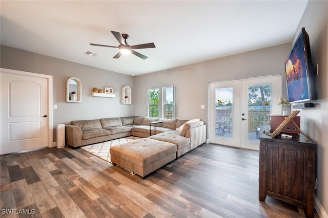 living room featuring ceiling fan, dark hardwood / wood-style floors, and french doors