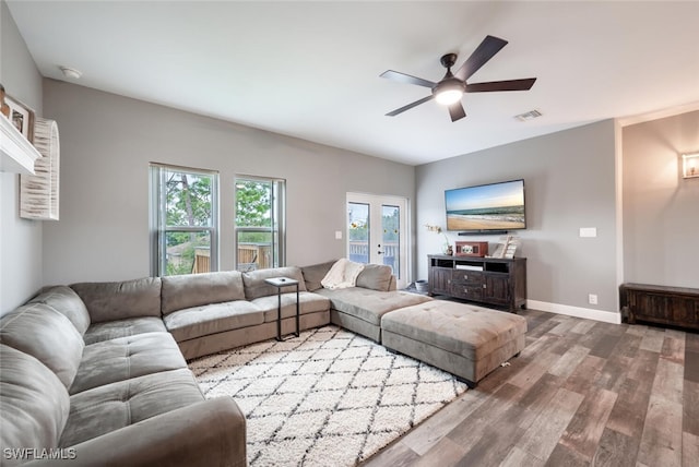 living room featuring hardwood / wood-style flooring and ceiling fan