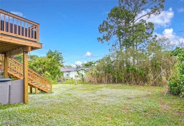 view of yard with a wooden deck