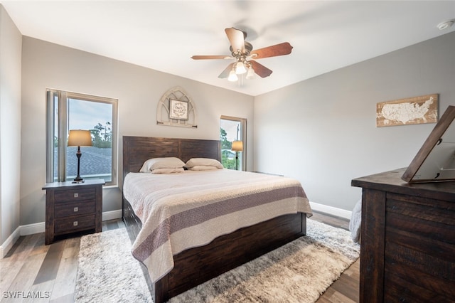 bedroom featuring ceiling fan and light hardwood / wood-style floors