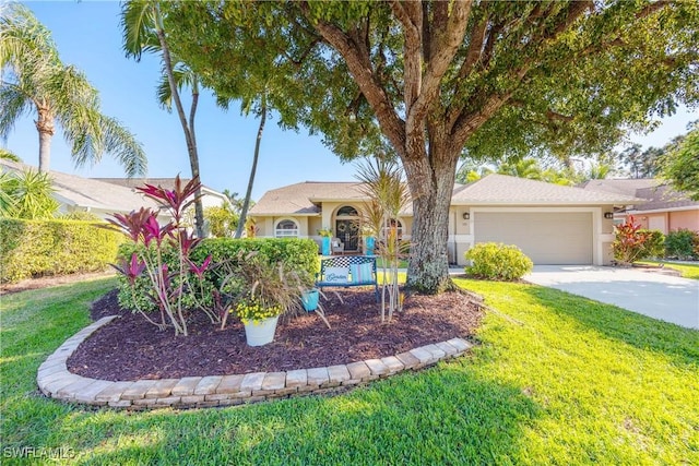 view of front of house with a front yard and a garage