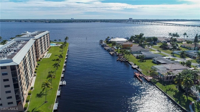 birds eye view of property with a water view