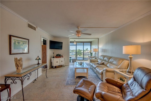 tiled living room featuring ceiling fan and crown molding