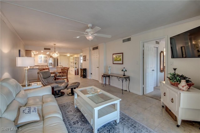 living room featuring ceiling fan, crown molding, and light tile patterned flooring