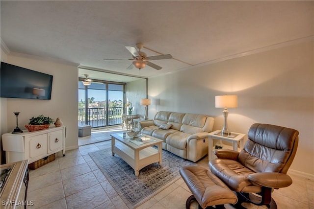 living room featuring ceiling fan and ornamental molding