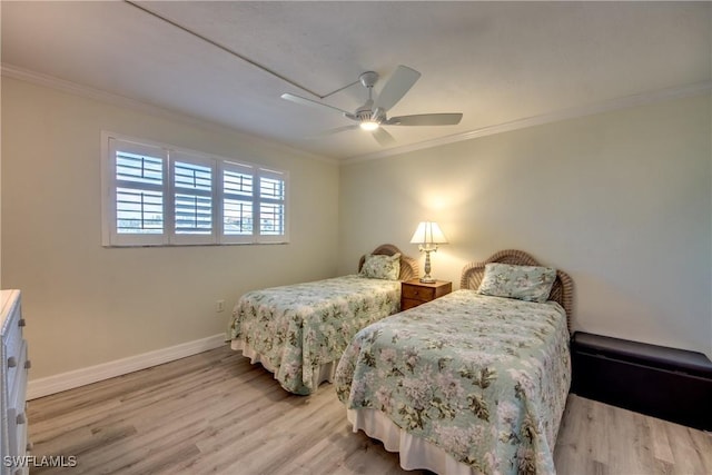 bedroom featuring ceiling fan, light hardwood / wood-style floors, and ornamental molding