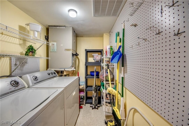 clothes washing area featuring washing machine and clothes dryer