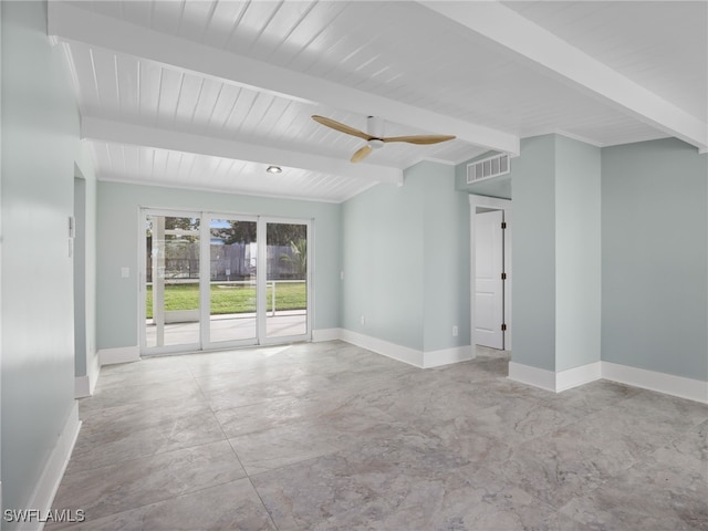 empty room featuring ceiling fan and beamed ceiling