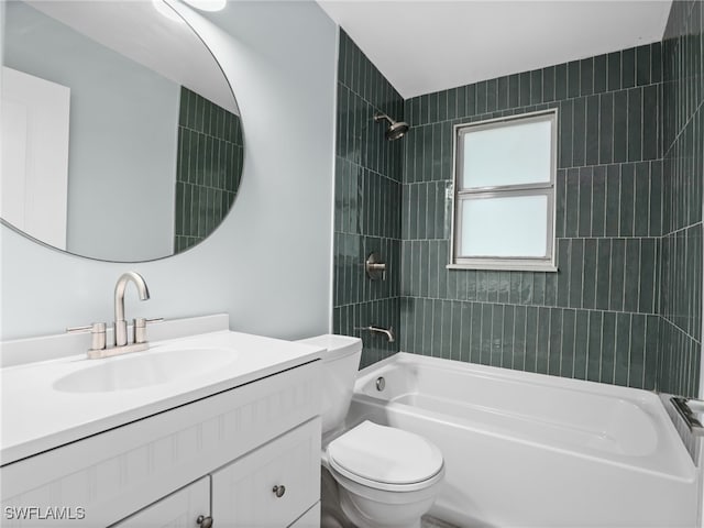 full bathroom featuring tiled shower / bath combo, vanity, and toilet