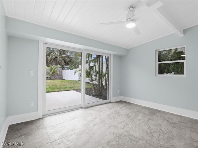 empty room with a ceiling fan, wood ceiling, baseboards, and beamed ceiling