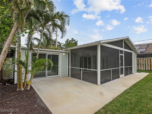 back of property featuring a sunroom