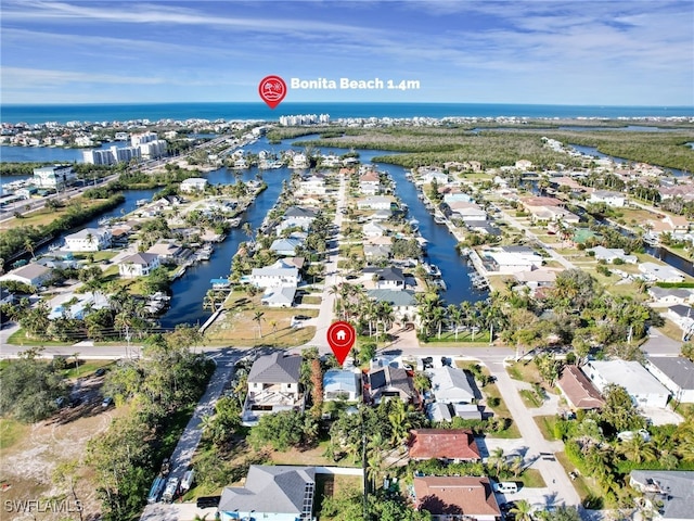 birds eye view of property with a residential view and a water view