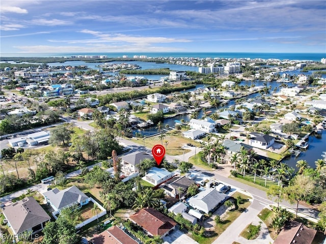 birds eye view of property featuring a residential view and a water view