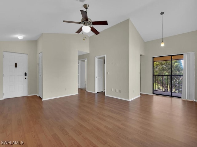 unfurnished living room featuring ceiling fan, high vaulted ceiling, and hardwood / wood-style floors