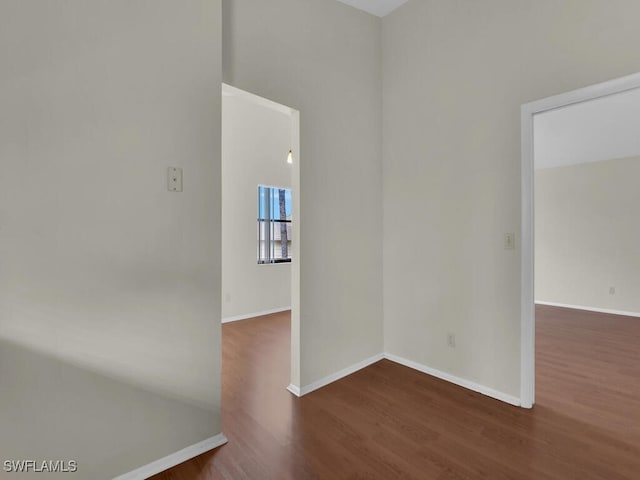 unfurnished room featuring dark hardwood / wood-style floors