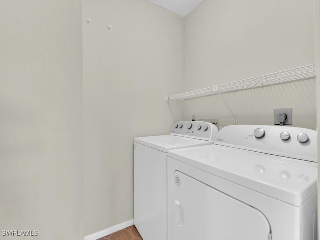 laundry room with washing machine and clothes dryer