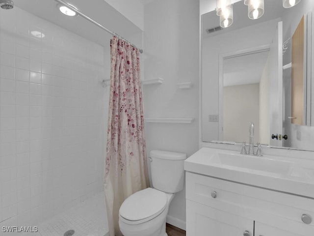 bathroom featuring vanity, toilet, and a shower with shower curtain