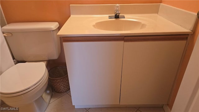 bathroom featuring vanity, toilet, and tile patterned floors