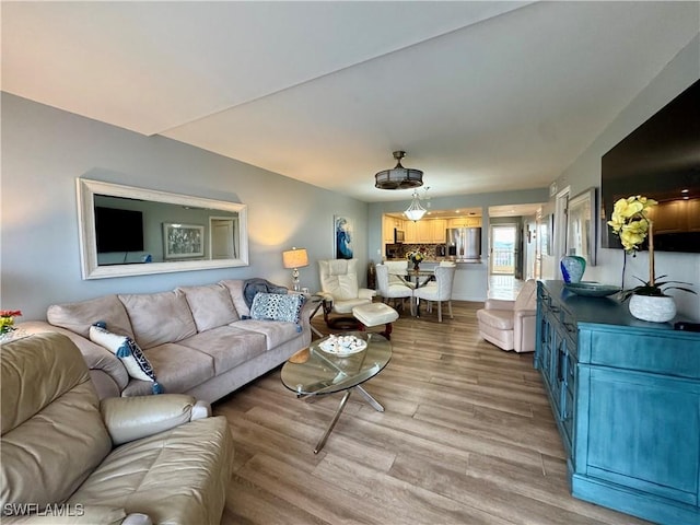 living room with light hardwood / wood-style flooring