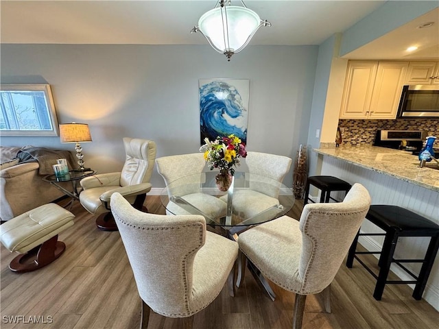 dining room featuring light hardwood / wood-style flooring