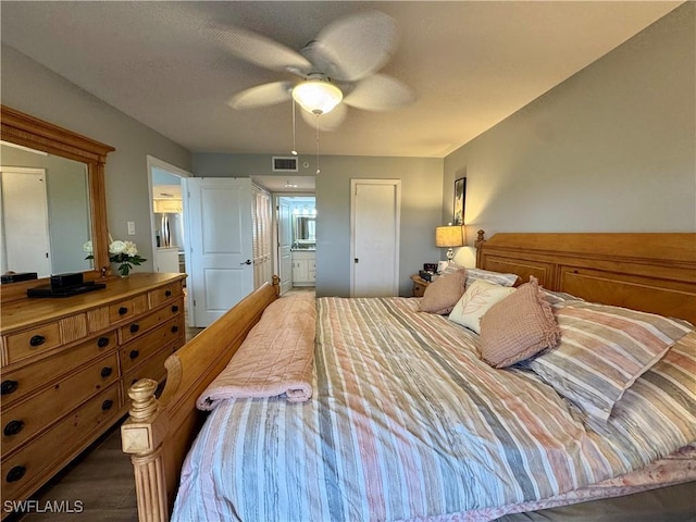 bedroom featuring ceiling fan and connected bathroom