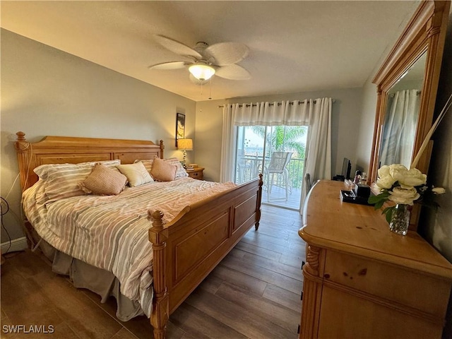 bedroom featuring dark hardwood / wood-style flooring, ceiling fan, and access to exterior