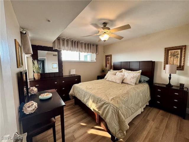 bedroom featuring hardwood / wood-style floors and ceiling fan