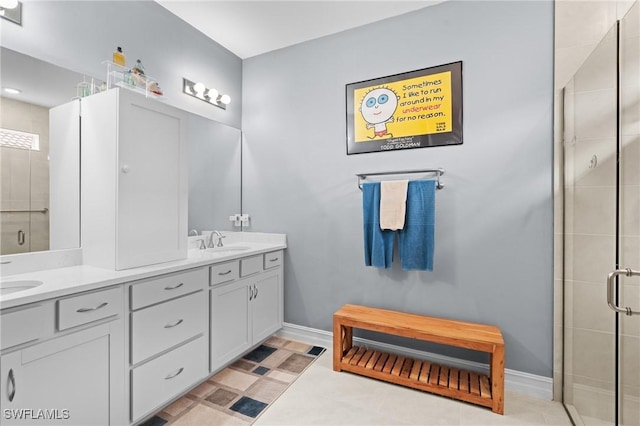 bathroom featuring walk in shower and vanity