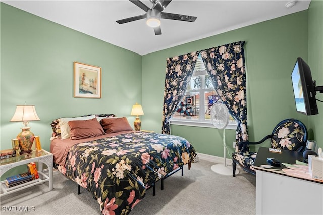 bedroom with ceiling fan and carpet flooring