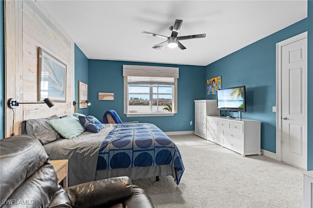 bedroom with light carpet and ceiling fan